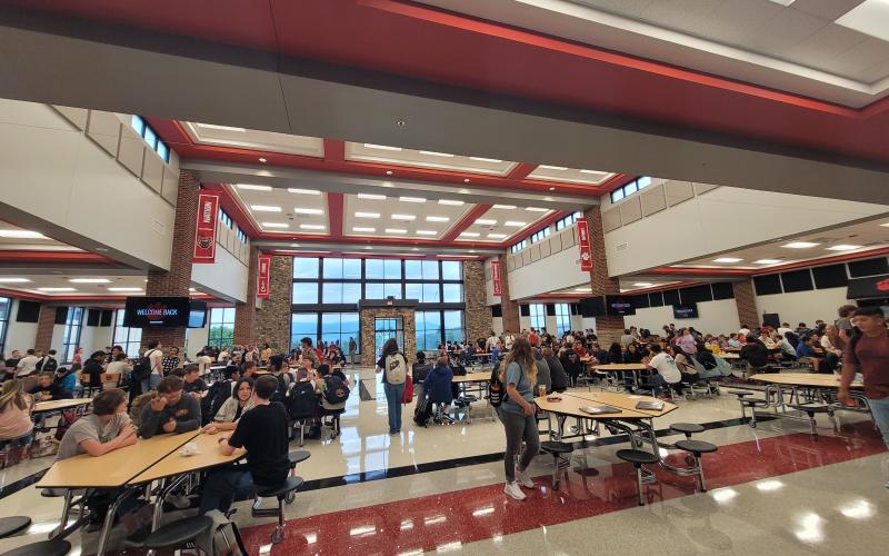 Megan Broome/The Clayton Tribune. Excitement fills the cafeteria as students at Rabun County Schools reconnect on the first day of school August 5 and prepare for the new school year before the bell rings to begin classes for the day.