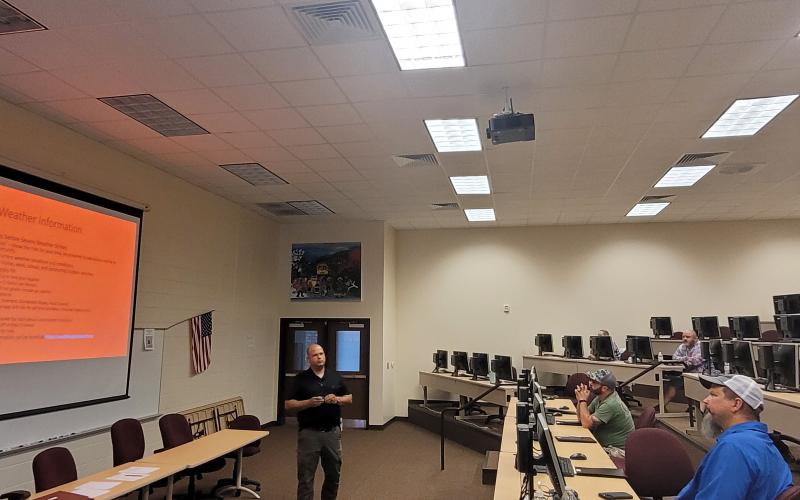 Megan Broome/The Clayton Tribune. Brian Panell, Rabun County EMA director, discusses how to be prepared in instances of hazardous weather and what to do before severe weather strikes. The course was part of training for bus drivers to prepare as kids go back to the classroom Friday.