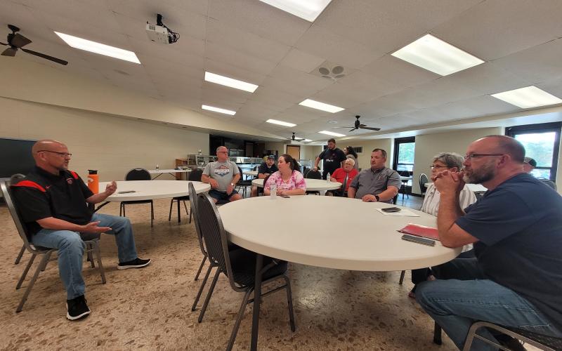 Megan Broome/The Clayton Tribune. Scott Crane, safety coordinator for Rabun County Schools, talks to bus drivers at the Board of Education Tuesday as they participate in their annual training courses to prepare as kids go back to the classroom Friday. Crane talked about safety protocols in place at the school and how these decisions are made.