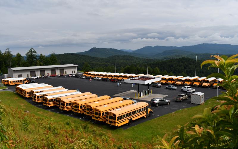 Enoch Autry/The Clayton Tribune. Vehicles in the July 30 motorcade arrive at the Rabun County transportation department with the buses ready for the school year on Aug. 5.