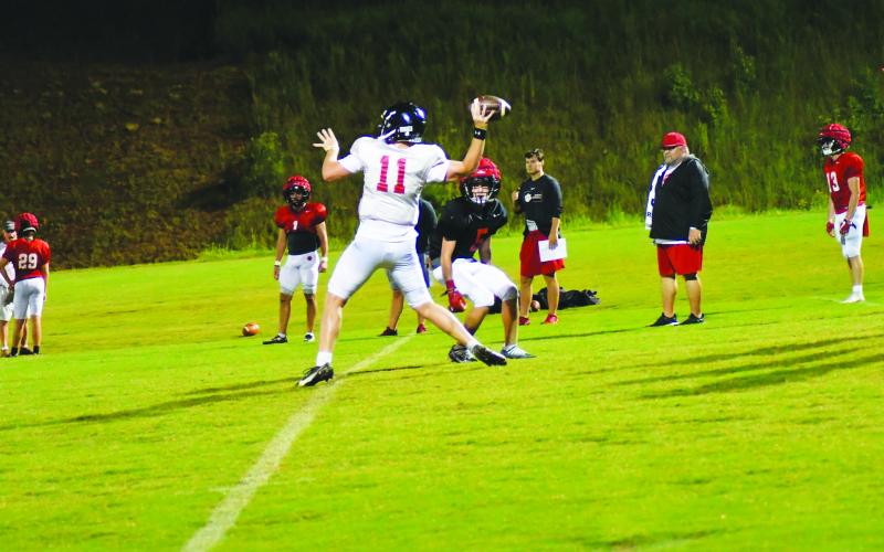 Enoch Autry/The Clayton Tribune. Rabun County starting quarterback Keegan Stover makes a throw during “Midnight Madness” at the school early in the morning of Aug. 1.
