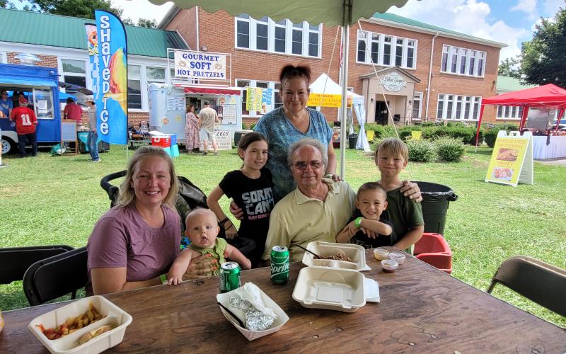 Megan Broome/The Clayton Tribune. The 25th Dillard Bluegrass and Barbeque Festival was fun for the whole family August 5 and 6 as attendees enjoyed live bluegrass music and food to support nonprofits in the region. Pictured are attendees from Franklin, N.C., Ashlie Baillio; Carl Pollick; Maria Pollick; Owen Baillio; Alaina Detar; Caleb Detar; and Mikey Baillio.