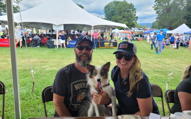 Megan Broome/The Clayton Tribune. The 25th Dillard Bluegrass and Barbeque Festival was fun for the whole family August 5 and 6 as attendees enjoyed live bluegrass music and food to support nonprofits in the region. Pictured are Wade and Lara Walker with dog Zoe.