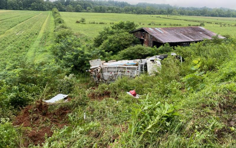 Photo courtesy of Brian Panell/Rabun County EMA Director. A 2015 Mack Granite carrying “blasting agents” overturned on its side early Tuesday morning at Kellys Creek Road in Rabun Gap.