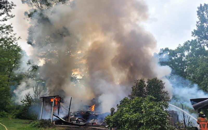 Megan Broome/The Clayton Tribune. Rabun County Fire Services work the scene of a structure fire on Flint Mountain Lane in Tiger Aug. 19. No injuries were reported.