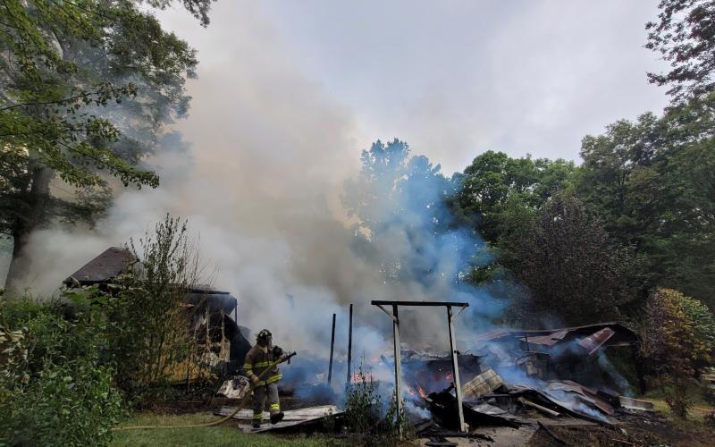 Megan Broome/The Clayton Tribune. Rabun County Fire Services work the scene of a structure fire on Flint Mountain Lane in Tiger Aug. 19. No injuries were reported.