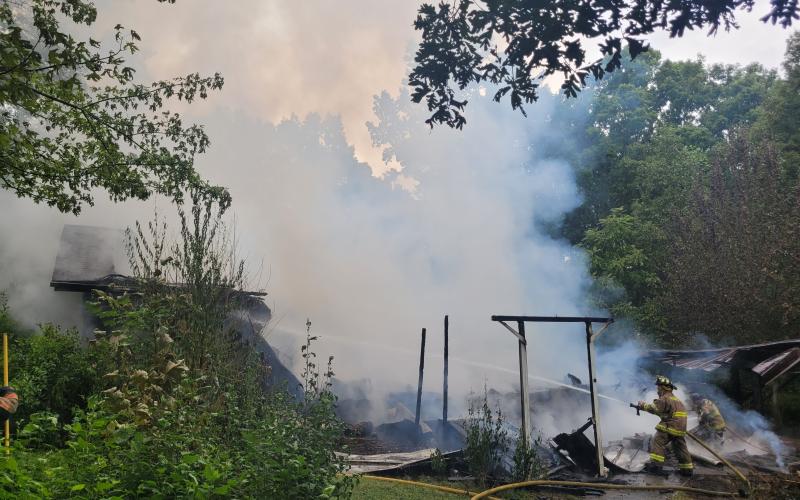 Megan Broome/The Clayton Tribune. Rabun County Fire Services work the scene of a structure fire on Flint Mountain Lane in Tiger Aug. 19. No injuries were reported.