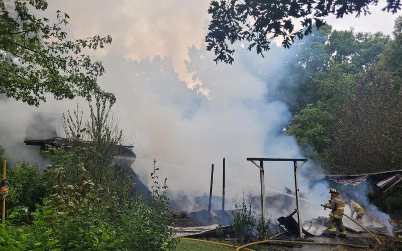 Megan Broome/The Clayton Tribune. Rabun County Fire Services work the scene of a structure fire on Flint Mountain Lane in Tiger Aug. 19. No injuries were reported.