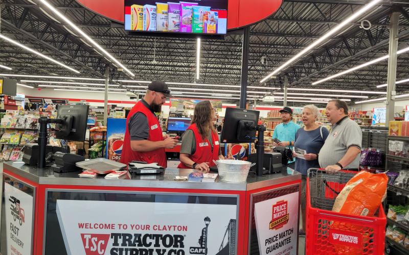 Megan Broome/The Clayton Tribune. Megan Broome/The Clayton Tribune. Rich Mallicote, Patty Mallicote and Conner Horn are some of the first handful of customers to make purchases at the new Tractor Supply store in Clayton. The customers are helped by Store Manager Chris Menius and Angie Remsen. Tractor Supply, Co. held its Grand Opening and Ribbon Cutting event with Forward Rabun and the Rabun County Chamber of Commerce on July 29. The new store features a greenhouse and dog/pet washing station.