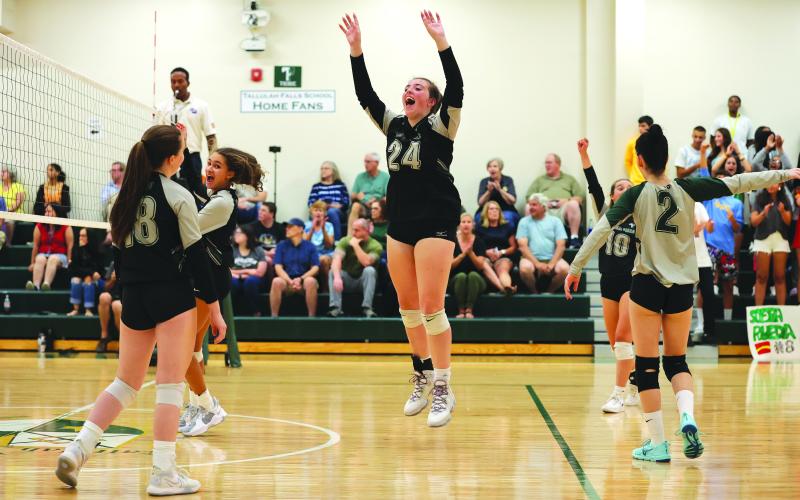 Courtesy of Austin Poffenberger. Addy McCoy (middle) celebrates as TFS varsity goes 4-0 during the week.