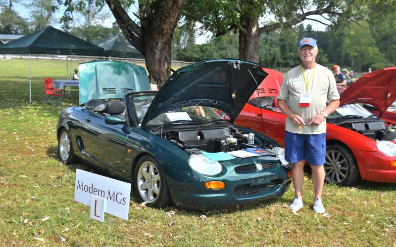 Megan Broome/The Clayton Tribune. Larry Norton, chairman of the North American MGB Register, showcases his 1996 MGF at the Southeast British Car Festival held at The Dillard House last weekend.