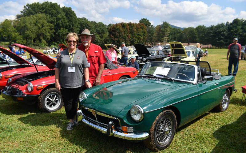 Megan Broome/The Clayton Tribune. Rick Watts and Cheryl Mauney from Covington, Ga. showcase a 1975 MGB at the Southeast British Car Festival.