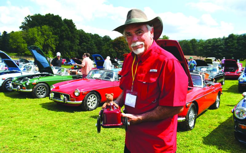 Megan Broome/The Clayton Tribune. Rick Watts from Covington, Ga., showcases his race car made out of a valve cover that was used during small competitive races at the Southeast British Car Festival at The Dillard House in Dillard Saturday, Sept. 17. Watts showcased an MGB 1975 during the festival.
