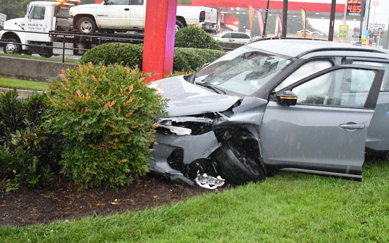 Megan Broome/The Clayton Tribune. This 2022 Silver Nissan Kicks crashed into the bushes beside the Chick-fil-A sign on Sunday, Sept. 4 following a two-vehicle crash in Clayton.