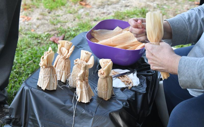 Megan Broome/The Clayton Tribune. Paulette Carpenter makes corn husk dolls and displays some of her creations at the Tiger Corn Festival over the weekend.
