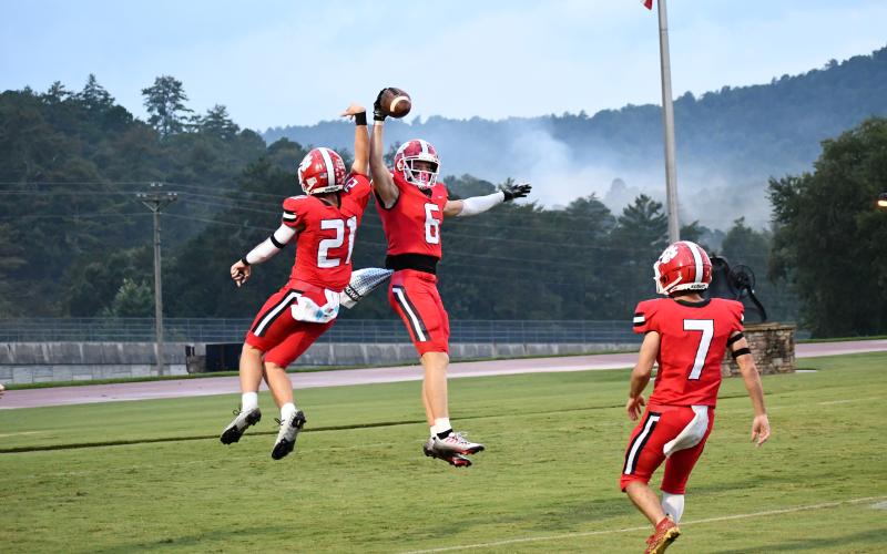 Luke Morey/The Clayton Tribune. Junior Paul Picciotti (left) and senior Jaden Gibson (right) celebrate after Gibson’s second touchdown of the first quarter.