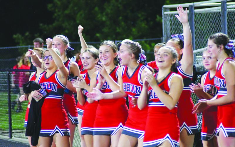 Enoch Autry/The Clayton Tribune. Cheerleaders cheer on their classmates.