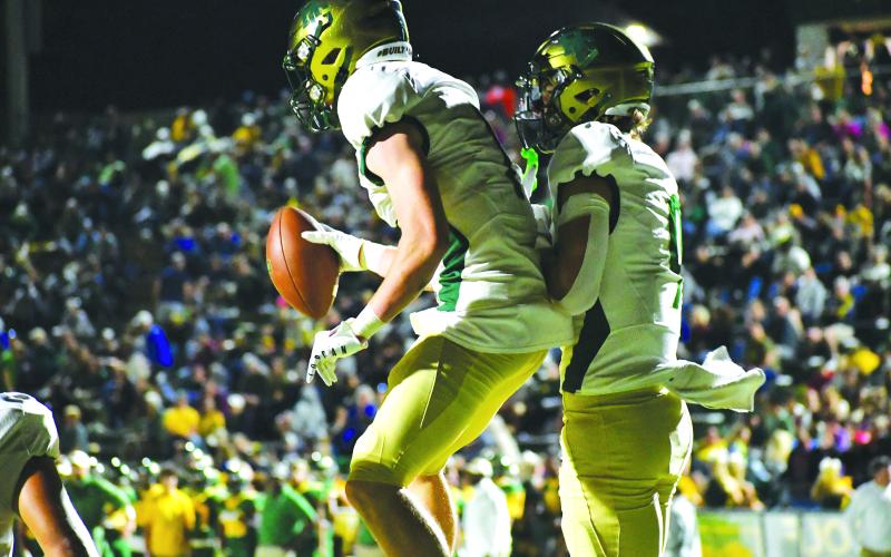 Luke Morey/The Clayton Tribune. Junior Trey Horne (left) celebrates a touchdown with sophomore Marshall Pritchett (right). Both players caught a touchdown on the night as well as Horne rushing for a touchdown.
