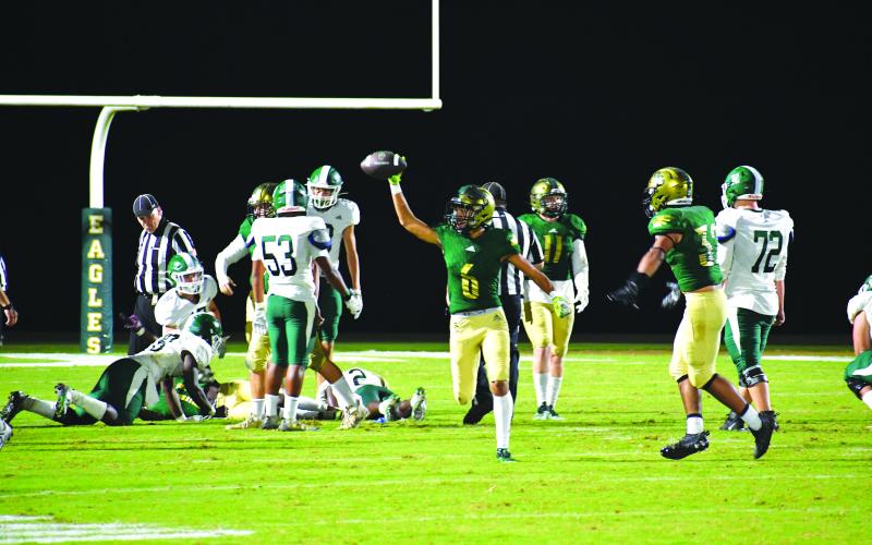 Luke Morey/The Clayton Tribune. Sophomore Patrick Williams celebrates recovering the fumble that ended the game.