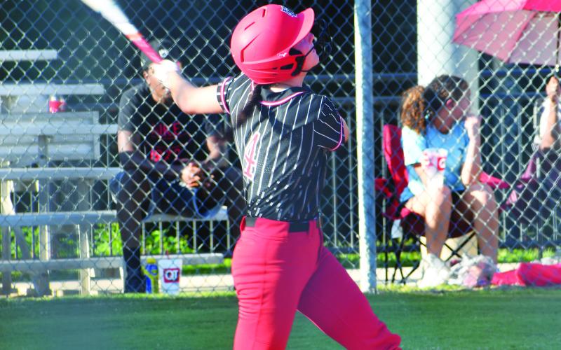 Luke Morey/The Clayton Tribune. Senior Mary Lovell hits a single during the game against East Jackson. Lovell ended the game with two runs, three hits, and two RBIs. Lovell and fellow senior Abigail Warren will be honored on the Lady Cats’ senior night, scheduled for Thursday night at 5 p.m.