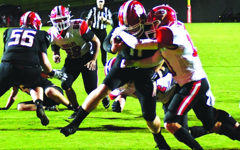 Enoch Autry/The Clayton Tribune. Senior quarterback Keegan Stover fights his way into the endzone for the only touchdown of the night for the Wildcats. Right after this play, he completed a two point conversion to Noah Legault to take a 14-7 lead.