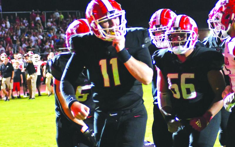 Enoch Autry/The Clayton Tribune. Senior transfer Keegan Stover rushes for a touchdown against Stephens County. Stover has 13 passing touchdowns as well as the one rushing touchdown three games into the season.