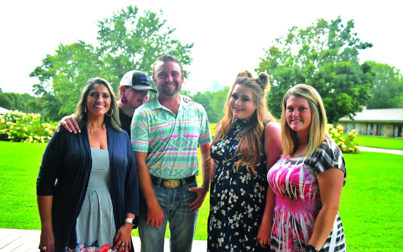 Megan Broome/The Clayton Tribune. Jo Flores, Natalie Dillard, Hunter Grayson, Ashley Cabe and Andria Robinson enjoy Labor Day weekend at The Dillard House on Sept. 4 with a BBQ cookout and live music performed by Grayson. The event promoted tourism to the area and brought the community together.