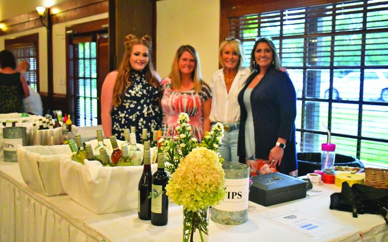 Megan Broome/The Clayton Tribune. Ashley Cabe, Andria Robinson, Louise Dillard and Jo Flores enjoy the food and festivities at The Dillard House Sept. 4 with a BBQ cookout and live entertainment performed by Hunter Grayson for Labor Day weekend.