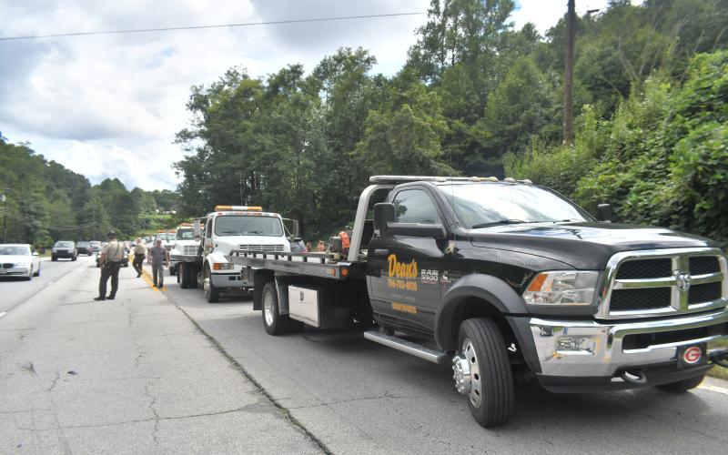 Megan Broome/The Clayton Tribune. Tow trucks arrive on scene to clear out the roadway following a four-vehicle crash on Georgia 15 at File Street near George Eller Curve in Mountain City Sept. 5.
