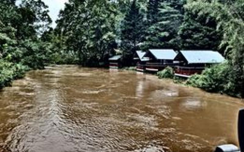 Photo courtesy of Kevin Croom. Kevin Croom snapped a photograph of flooding on Joy Bridge around noon on Monday. The Germany Valley Weather Station reported 6.15 inches of total rainfall through the holiday weekend. Below: Photo courtesy of Wanda Roe. Wanda Roe documents Warwoman Creek flooding Earl’s Ford.