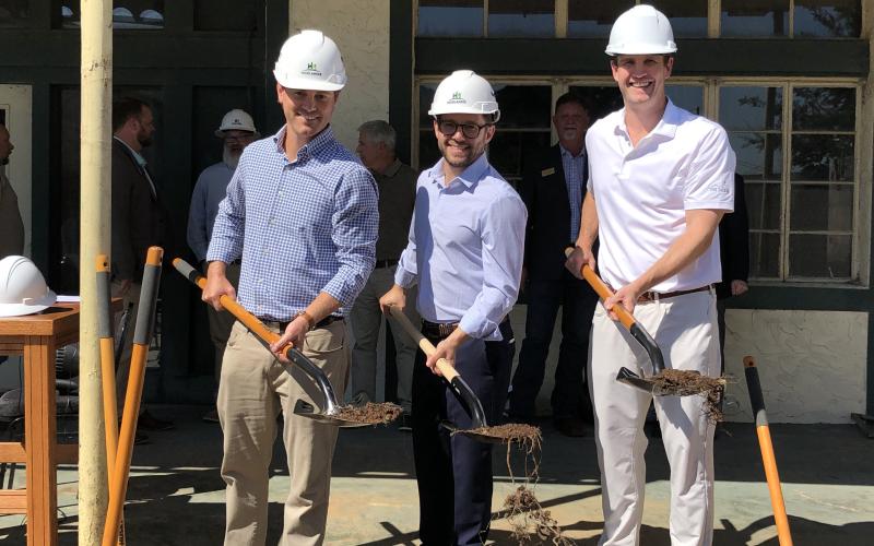 Tony Penrose/The Clayton Tribune. Tyler Caswell, Peter Evers and Mat Barnwell of  Ridgeline Investment Partners break ground on the Bridge Creek Inn in a ceremony Sept. 21.