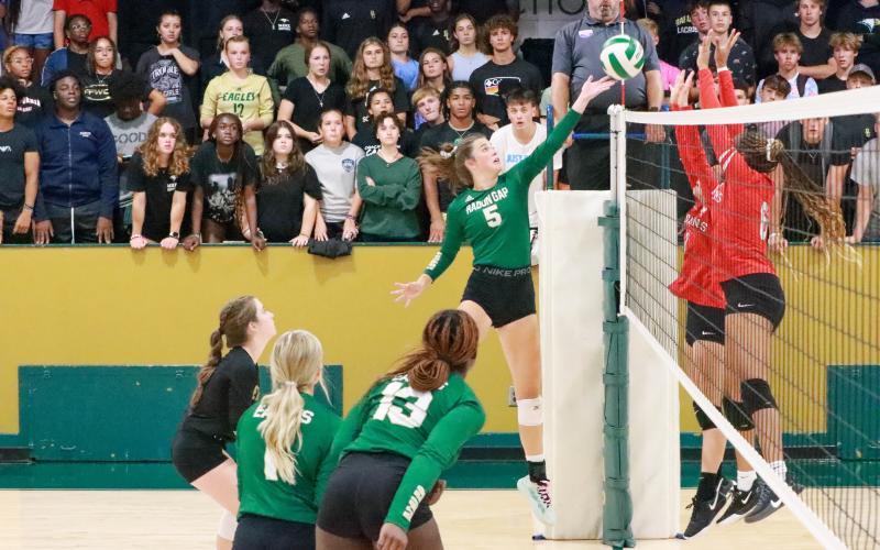 RGNS Athletics. Junior Peyton Brady tips the ball over the net