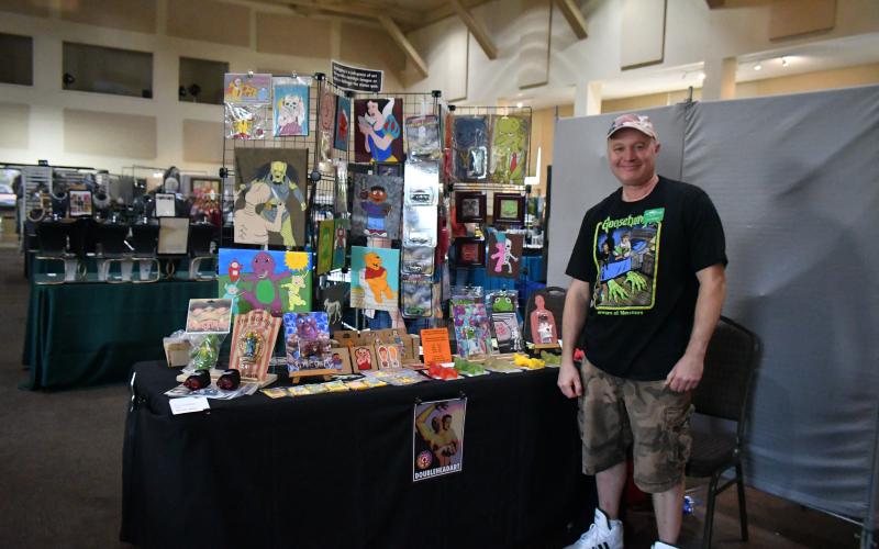 Megan Broome/The Clayton Tribune. Eric Hollifield showcases his crafts at the Painted Fern Art Festival.