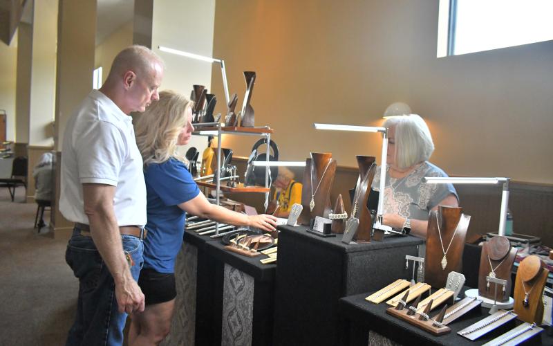 Megan Broome/The Clayton Tribune. Angelia Kiker and Robb Kiker from Clarkesville enjoy festivities during the Painted Fern Art Festival.