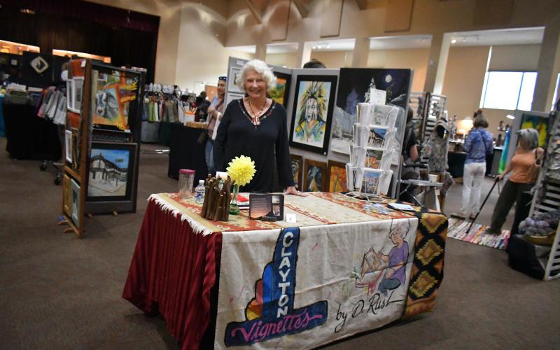 Megan Broome/The Clayton Tribune. Artist Diane Rush showcases her artwork at the Painted Fern Art Festival presented by the North Georgia Arts Guild.