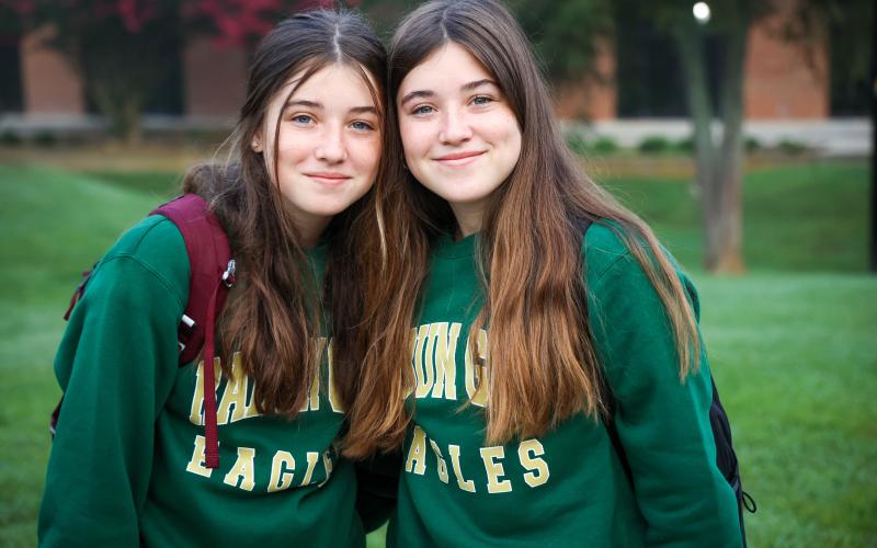 Photo courtesy of Rabun Gap-Nacoochee School. Twin sisters Eve and Margaret Kelly ’25 of Clayton, GA pose for a photo on the first day of school at Rabun Gap.