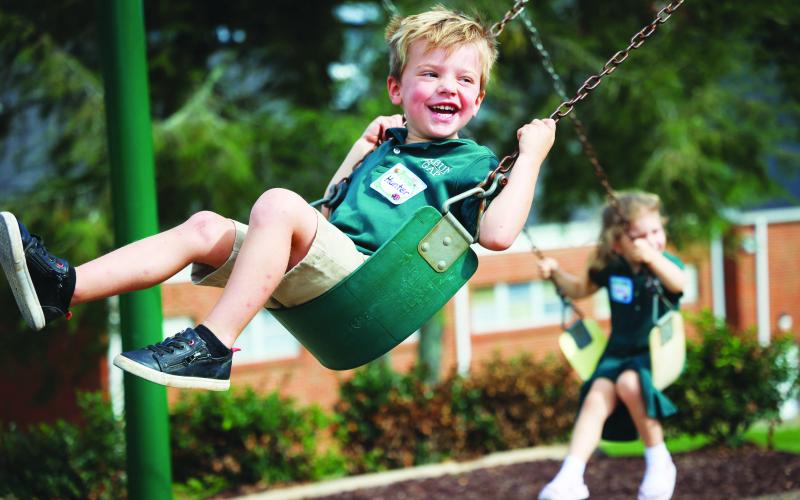 Photo courtesy of Rabun Gap-Nacoochee School. Rabun Gap-Nacoochee School opened the 2022-2023 school year on Aug. 24. Pictured is Early Learning student Hunter Weber as he swings on the playground. Weber will be a part of the Class of 2036.