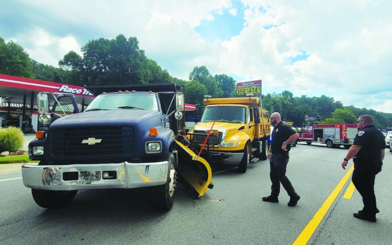 Megan Broome/The Clayton Tribune. Emergency personnel work the scene of a two-vehicle crash on Georgia 15 in front of RaceTrac in Clayton.