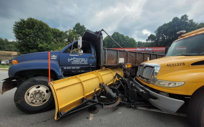 Megan Broome/The Clayton Tribune. Emergency personnel work the scene of a two-vehicle crash on Georgia 15 in front of RaceTrac in Clayton.