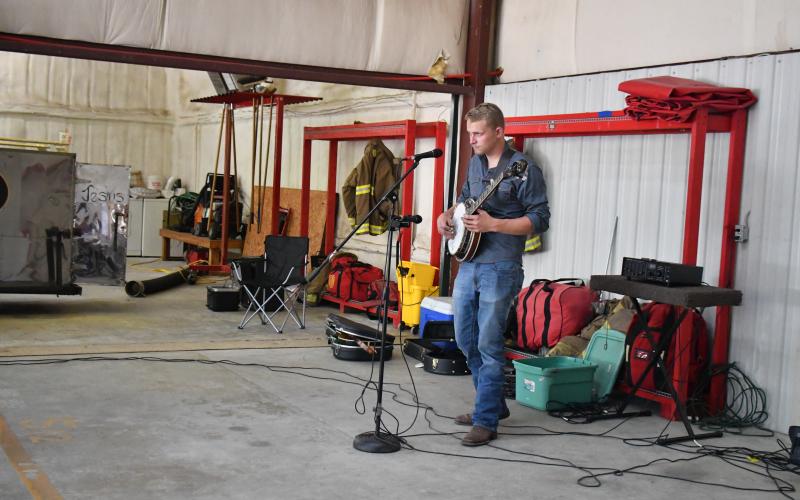 Megan Broome/The Clayton Tribune. Jake McCracken performs live music at the Rabun County Fire Services Station 12 BBQ Sept. 24.