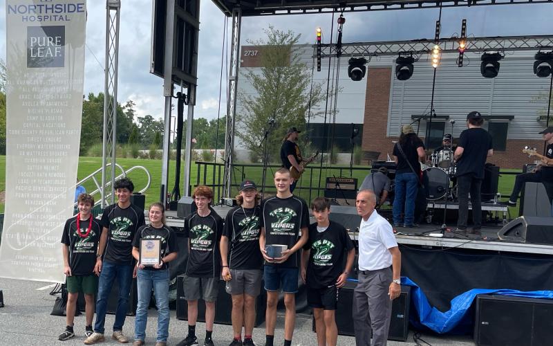 Submitted photo. Shown, from left, are Frankie Pribyl, Marc Crotta, Brooke Hayes, Matthew Wolfe, Jake Owensby, Teyrk Tilley, Merrick Carnes and Kennesaw Mayor Derek Easterling.