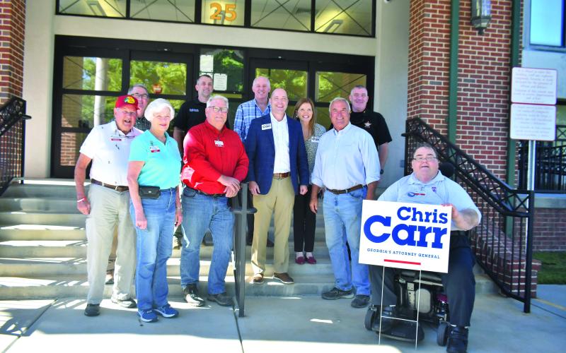 Megan Broome/The Clayton Tribune. Georgia Attorney General Chris Carr and his wife Joan stopped in Rabun County Sept. 27 to meet and greet public officials and community members. Front row: Charlie Brundage (left); Rabun County Republican Party Treasurer Linda Burns; Rabun County Republican Party Chair Ed Fickey; Georgia Attorney General Chris Carr; Commissioner Kent Woerner; and Rabun County Republican Party Secretary Ed Henderson. Back row: Scott Poss; Rabun County Sheriff’s Office Chief Deputy Scott Chee