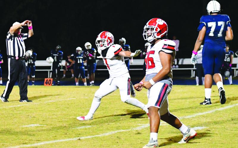 Luke Morey/The Clayton Tribune. Senior Nicholas Baloga (left) celebrates a fourth down stop with senior Cesar Cruz (right). Cruz has 42 total tackles and 4.0 tackles for loss on the year, while Baloga has 108 total tackles and 7.0 TFLs.