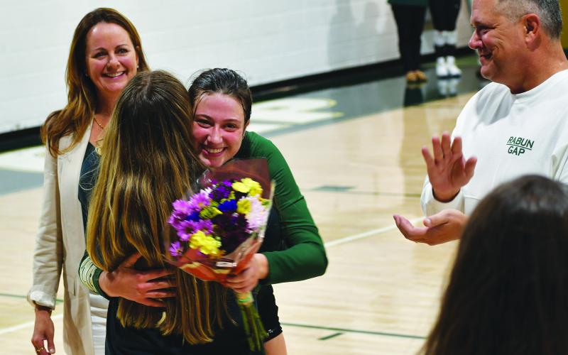 Luke Morey/The Clayton Tribune. RGNS volleyball three seniors Claren Spivey, Cheney Moriarty and Calea Jakson were honored by head coach Zoe Kennedy and Amy Westbrook on Oct. 12.