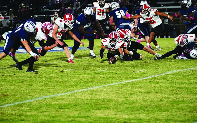 Luke Morey/The Clayton Tribune. Senior Emiliano Ortiz (73) falls on a loose ball to give the ball back to the Rabun County offense as Cory Keller (8), Ethan Owens (45), Paul Picciotti (21) and Cesar Cruz (66) look on.