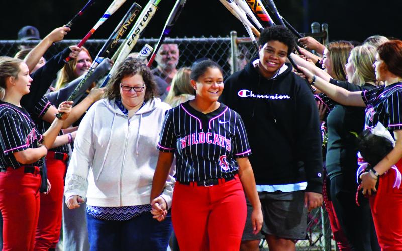 Enoch Autry/The Clayton Tribune. Senior Abigail Warren is escorted by her mother Tammie Payne and brother Joseph Payne.