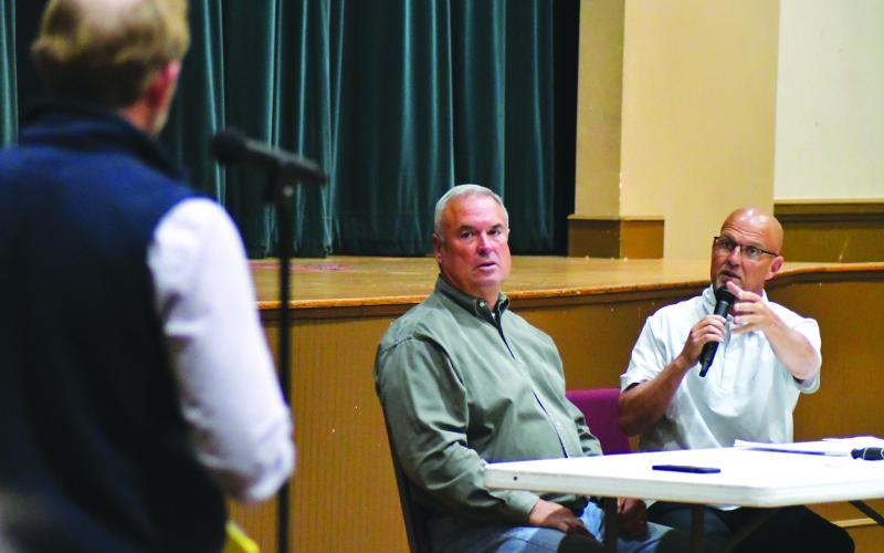 Enoch Autry/The Clayton Tribune. Seated beside Rabun County Commissioner Kent Woerner, Scott Crane clarifies the proposed ordinance change will not result in short-term property owners losing their properties.