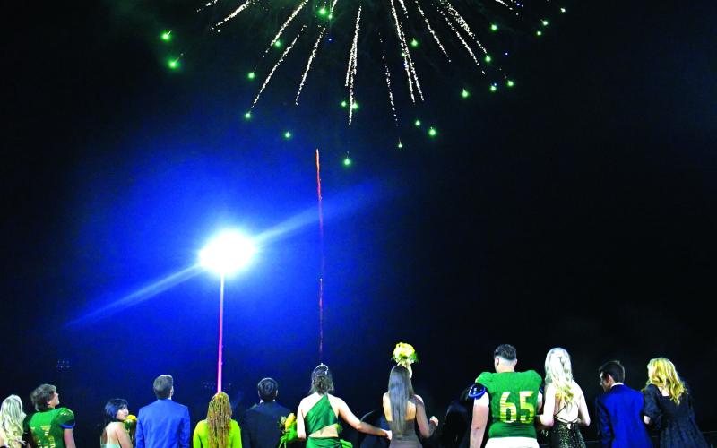 Enoch Autry/The Clayton Tribune. Following the crownings of Cheney Moriarty of Hong Kong as Queen and Zeke Coghill of Saudi Arabia as King, fireworks lit up the nighttime sky.