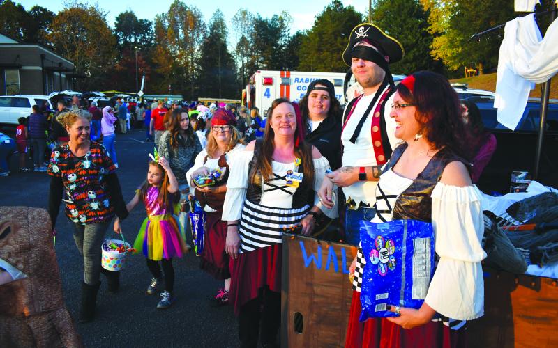 Enoch Autry/The Clayton Tribune. Employees from Walmart changed things up as these pirates gave out candy instead of taking.