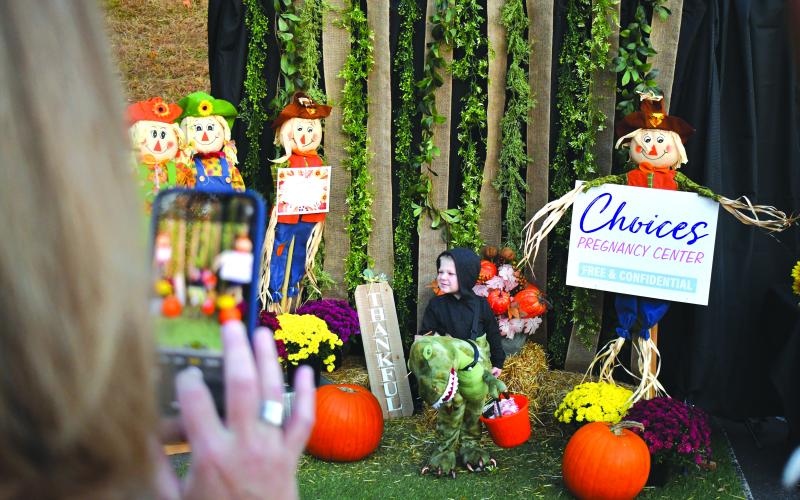 Enoch Autry/The Clayton Tribune. Choices Pregnancy Center had a photo-worthy setup for children and adults. For those who snapped pictures on their cell phones and uploaded the images, one lucky person had the chance to win $200.